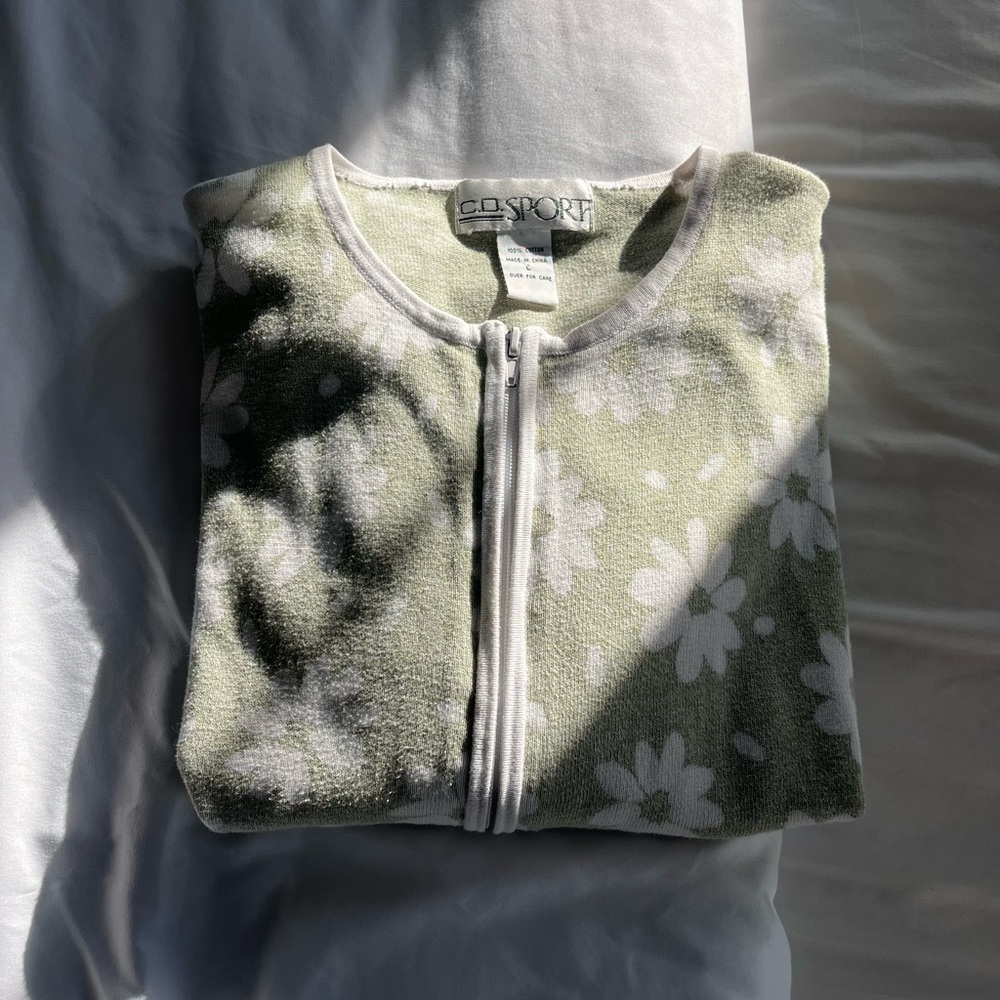 Green fabric jacket with floral pattern